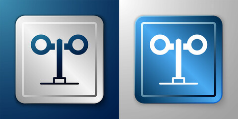 White Train traffic light icon isolated on blue and grey background. Traffic lights for the railway to regulate the movement of trains. Silver and blue square button. Vector