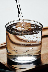 Pouring water into glass