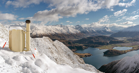 Toilet with amazing view of snowy mountains at the top of Roy's Peak. Wanaka, New Zealand
