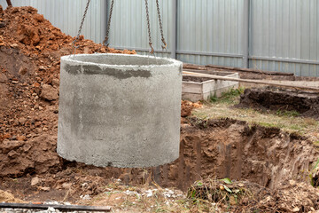 Installation of underground tank for sewage system. - obrazy, fototapety, plakaty
