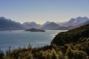 Lake Wakatipu scenic lookout with snowy peak mountain views. Queenstown, New Zealand