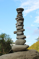 Fototapeta na wymiar River stones in balance on natural background