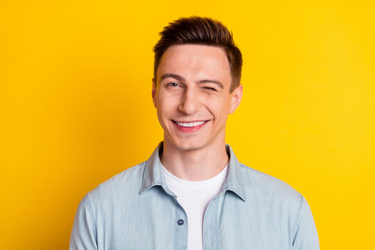 Portrait Of Young Attractive Handsome Flirty Man Wink Blink Eye Romance Expression Isolated On Yellow Color Background