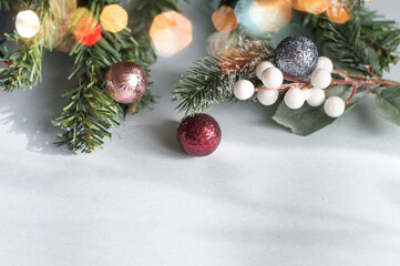 Christmas background with spruce branch, bokeh, Christmas decorations. Top view and place for text.