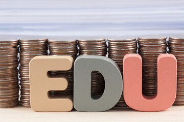 A large number of coins and the abbreviation EDU