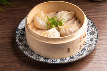 Traditional Asian food in a bowl. Hot dish dumpling