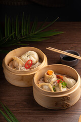 Traditional Asian food dumpling in a bowl Hot dish dim sum served in a national wooden bowl