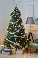 Room decorated for Christmas or new year. The interior of the room with a Christmas tree and decorations