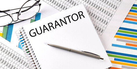 Notebook with text GUARANTOR . Diagram and white background