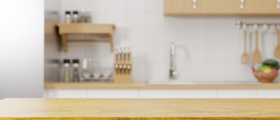 Wooden kitchen counter top for montage over blurred modern minimalist kitchen in the background. - obrazy, fototapety, plakaty