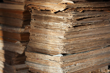 A lot of ragged antique books in soft cover