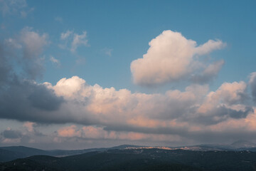 Sunset colored clouds above Western Galilee Mountains as seen from Eagles Cliff Park in Mi'ilya village, Upper Galilee, Northern District of Israel, Israel