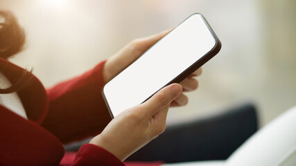 Business women using modern smart mobile phone. phone blank screen mockup