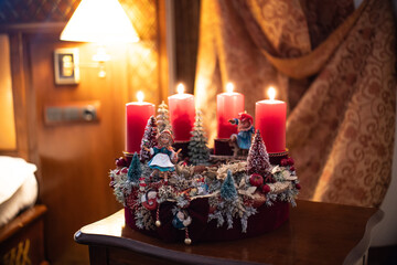 Christmas table composition. Beautiful decoration. Christmas trees, candles, stars, lights and elegant accessories. Merry Christmas and Happy Holidays, Template.