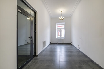 long white empty corridor in interior of entrance hall of modern apartments, office or clinic