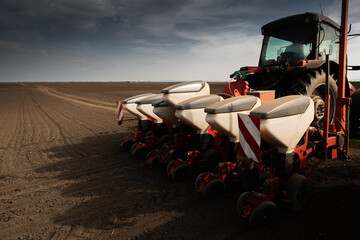 Farmer with tractor seeding