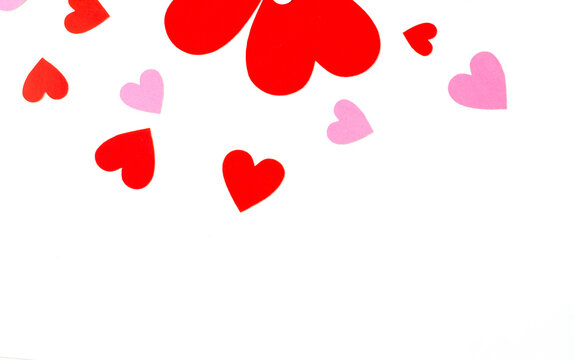 heart shaped red and pink paper isolated on a white background, concept love and valentine's day.