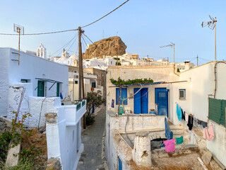 Pedestrian street of Greek Chora village built around a large rock on Amorgos island, Aegean Sea,...