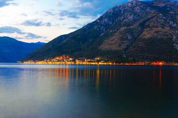 Perast coast town at Kotor Bay in Montenegro  . Evening view of illuminated Perast old town 