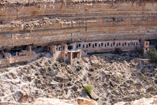 Scenic view of Old stone houses, Palm trees Oasis , Mountains from Ghoufi Canyon in the Aures region, Algeria