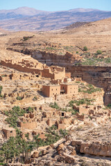 Scenic view of Old stone houses, Palm trees Oasis , Mountains from Ghoufi Canyon in the Aures region, Algeria