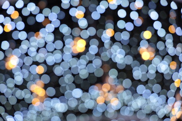 Blur bokeh lights in festival season in the city, abstract blurred festive background