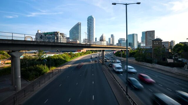 Time-lapse of car and train traffic with London skyline
