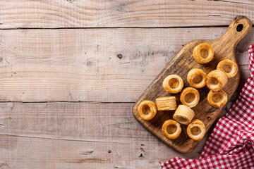 Traditional English Yorkshire pudding on wooden table. Copy space