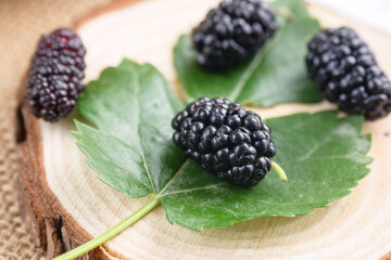 Ripe large black mulberries close up