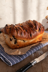 Brioche with chocolate chips on wooden background,french recipe