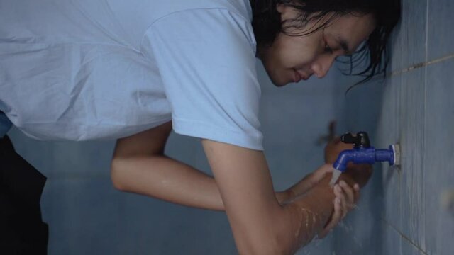 Man muslim perform ablution wudhu washing hand