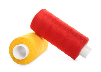 Different colorful sewing threads on white background