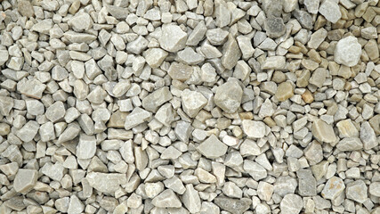 Granite gravel of macadam, Rock gray crushed for construction on the ground, Scree texture background