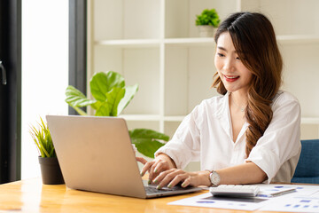 Finance Investment Ideas on Company Growth Project Success Statistics A professional investor working on starting a project for a strategic plan with a document, a laptop, on an office table.