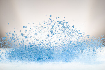 explosion of flour and components, lifting them into the air on a white surface