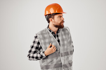working man in working uniform construction building profession light background