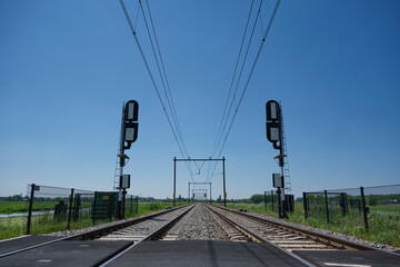 road crossing the railway and the barrier