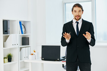man in a suit in the office with documents executive