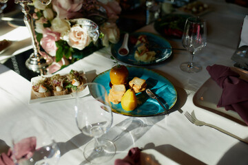 Beautiful festive table setting with candles and flowers.