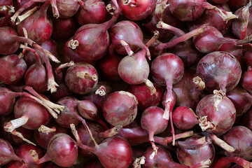 Fresh red onion as background. Close up top view.
