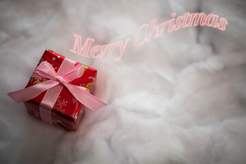背景素材　クリスマスプレゼントとメリークリスマスのロゴ