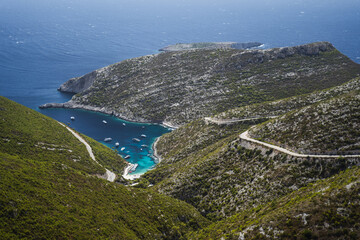 Porto Vromi. Ionian sea bay with moored and anchored boats. Zakynthos island sightseeing spot. Greece