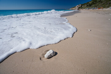 Waves on Milos sandy beach - Agios Nikitas village on Lefkada Ionian island, Greece. travel concept