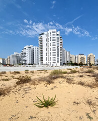 City construction among desert dunes. Building yard of Housing construction of houses in new area of the city Holon in Israel
