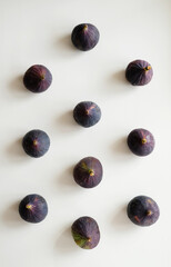 Fresh figs on a white background, layout in geometric order