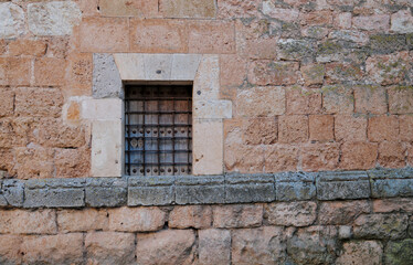 Small window on stone wall in Ayllon, Spain