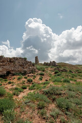 Ruins of an ancient fortress. An old wall of large stones. The remains of a former civilization.