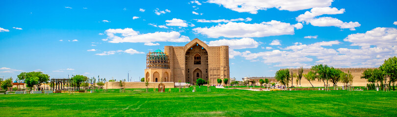 Mausoleum of Khoja Ahmed Yasawi in the city of Turkestan. The historical center of Kazakhstan. Islamic religion, Muslim dignity. The Silk Road is a tourist place. - obrazy, fototapety, plakaty