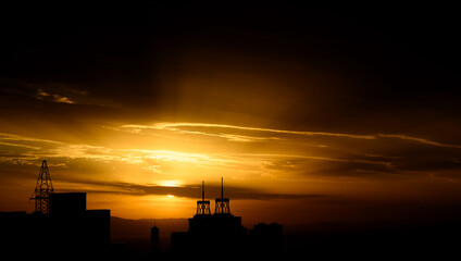 Sunset and silhouette of buildings.