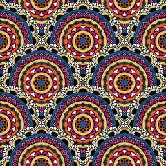 Abstract seamless mandala background. Texture in blue, orange and white colors. Oriental pattern for design, fashion print, scrapbooking